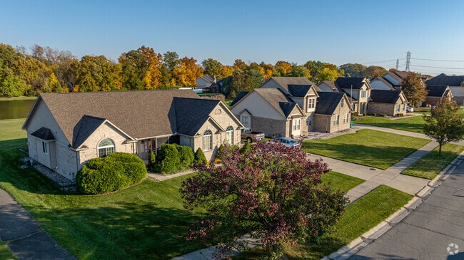 Stone homes line sidewalked streets in Woodhaven.
