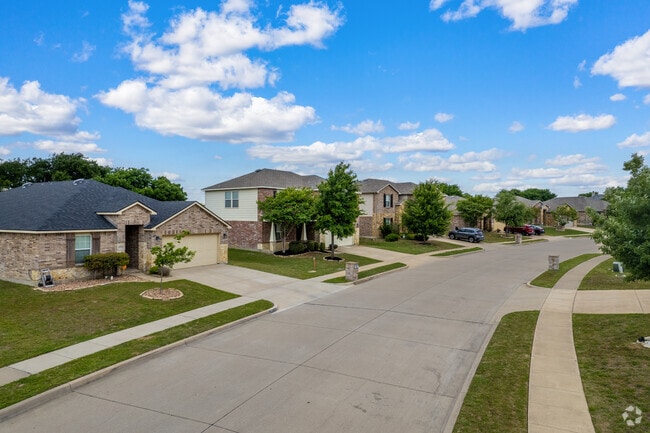 Traditional 2-story brick homes in Crowley, TX.