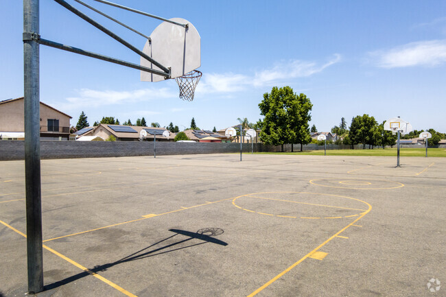 Students play basketball at Freedom Elementary School in Clovis.