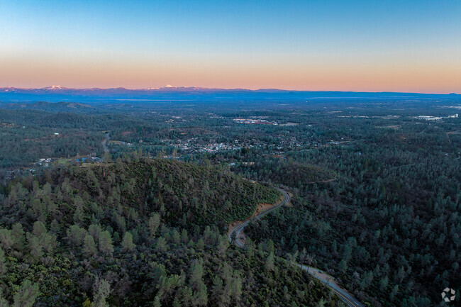 A winding road provides beautiful views of downtown Shasta Lake.