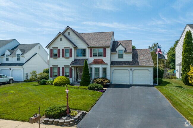 Properties in Lampeter sit on manicured lawns that stretch towards sidewalks.
