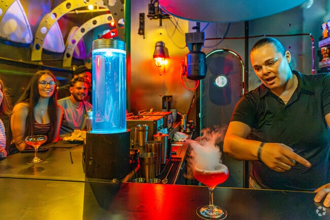 The Mixologist at the Argonaut Bar and Lounge gives the patrons a show in Tavares.
