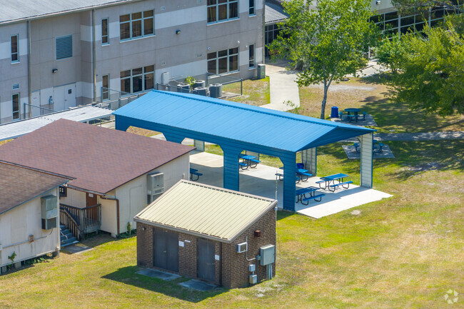 Students sit under the pavilion at Professional Academy Magnet at Loften High School.