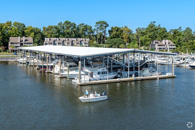 Locals take out their boats from Bradley Creek Marina to ride along the waterway.