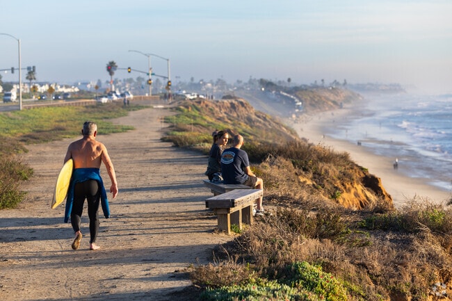 This couple is enjoying the sunset at Carlsbad State Beach.