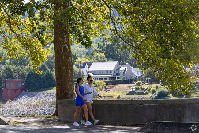 East End residents enjoy walking along with Kanawha River while catching up with friends.
