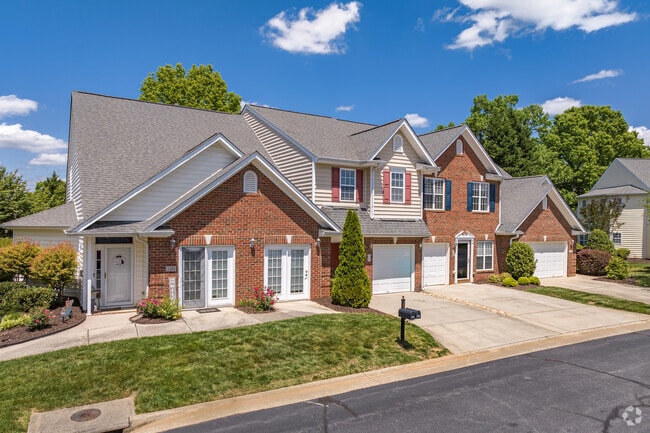 The townhomes in East Fork Deep River feature well-maintained lawns.