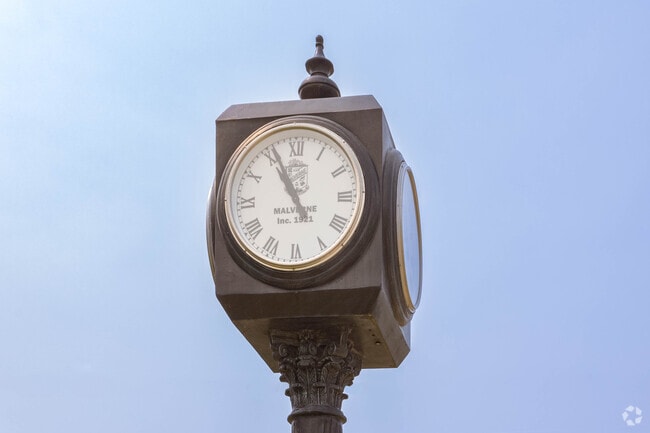 There is a working clock by the train station in downtown Malverne.