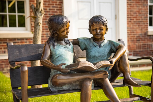 This statue sits outside the Smithtown Public Library in Village of the Branch.
