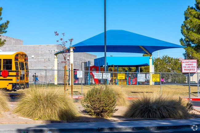 Jim Thorpe Elementary School students stay out of the sun under the covered playground.