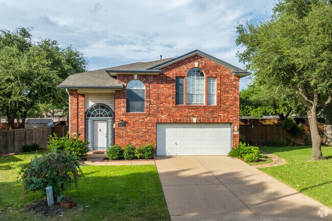 Well-kept lawns line contemporary brick homes across Sendera.