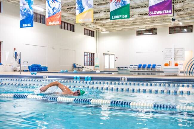 Residents swim laps at the indoor pool at Heritage Park Sports Complex fitness center.