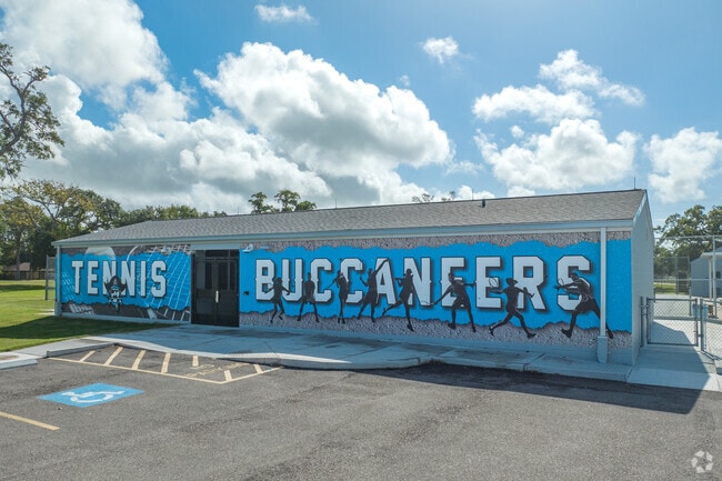 The school's mascot is the Buccaneer, and the school colors are navy blue and silver.