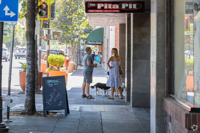 People talk to each other on the street in Chico.