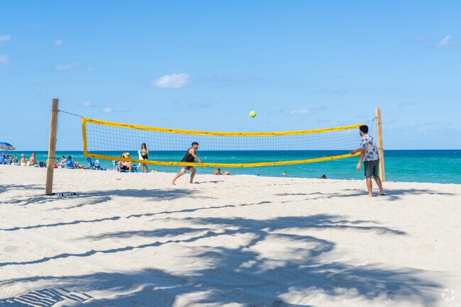 Play beach volleyball along the sandy shores near Driftwood Acres at Hollywood Beach.