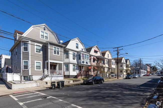 Full block row of dutch colonial homes line most streets in Irvington, NJ.