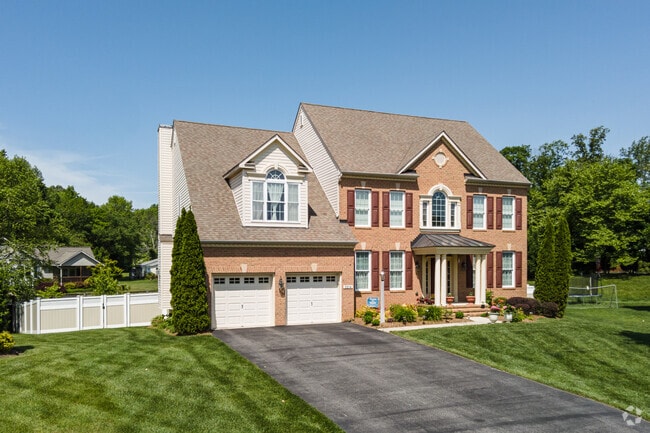 Many homes in Riva, MD like this red brick colonial come with a decent amount of yard space.