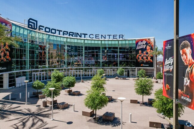 Phoenix Suns banners hang at Footprint Center entrance in Central City.