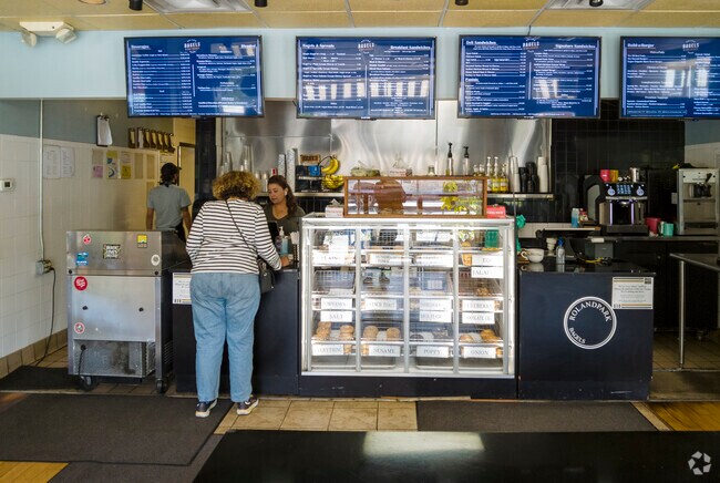 Evergreen residents enjoy local retail and dining options on W. Cold Spring Lane, including Roland Park Bagel.