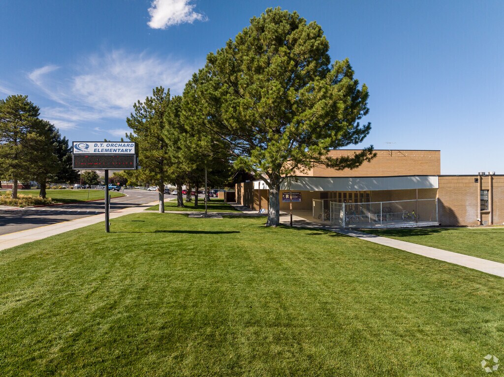 D.T. Orchard Elementary School has a gorgeous front lawn with mature pine trees.