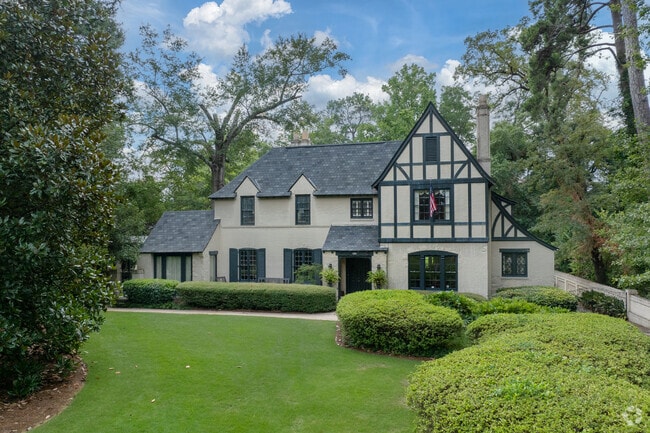 This two-story Tudor home features steep roofs, timber frames, and charm.