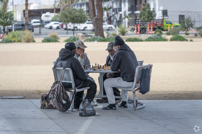 Local East Las Vegas residents enjoy an afternoon playing chess with friends.