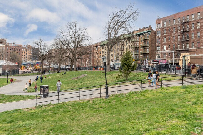 Devoe Park's lush greenery breaks up the tough brick facades of the Fordham Manor neighborhood.
