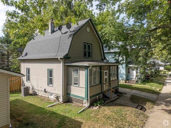 A picturesque Dutch colonial home graces Neighbors Who Care with its classic design.