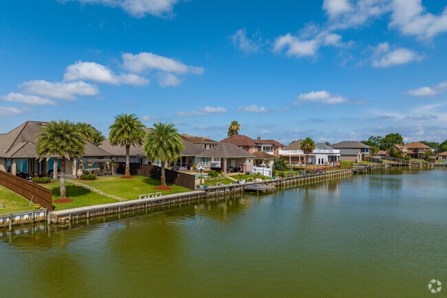 A few homes sit along a small lake in the center of Read Boulevard East.