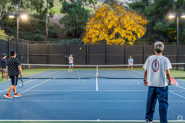 Friends enjoying a game of Tennis on a warm Friday night at the Rowland Heights Community Center