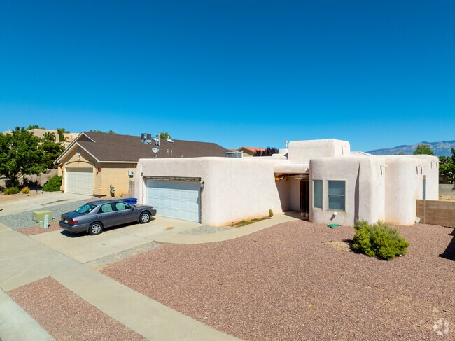 Pueblo-style homes in Tuscany feature thick stucco and rounded corners.
