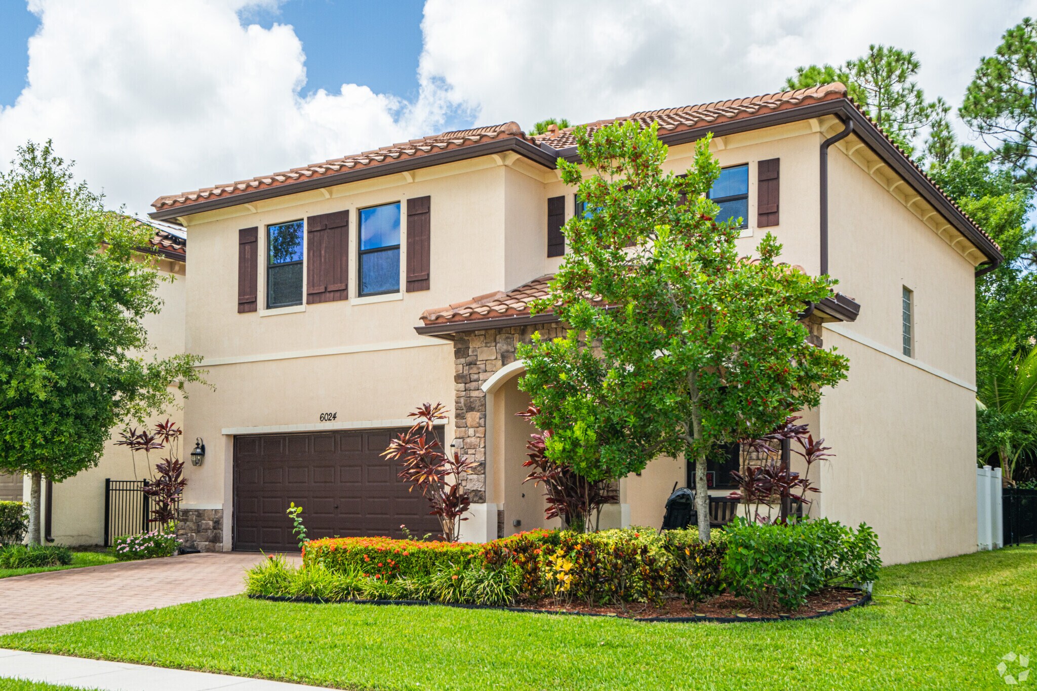Dillman Farms' row homes showcase beautiful front gardens and inviting facades.