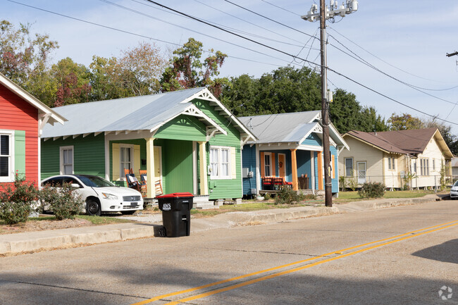 Single story colorful cottage homes line the streets of the West End, Lafayette.