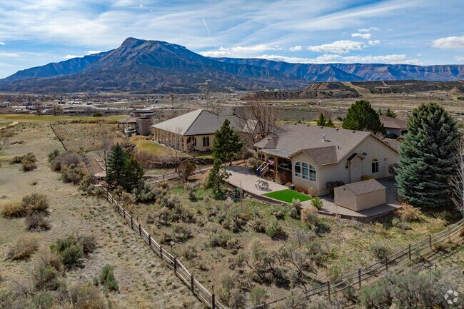 With the majestic Bookcliffs in the distance, Battlement Mesa, Colorado, boasts newly built homes that offer modern amenities and stunning backdrops.