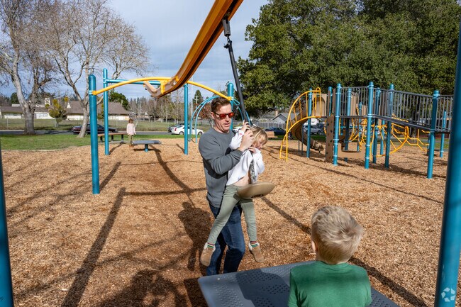 The zipline at Willard Libby Park is a popular attraction for families seeking fun.