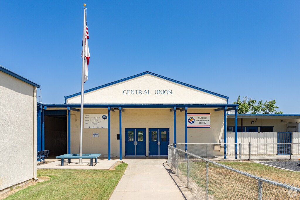 An American flag waves at the entrance to Central Elementary School in Lemoore.