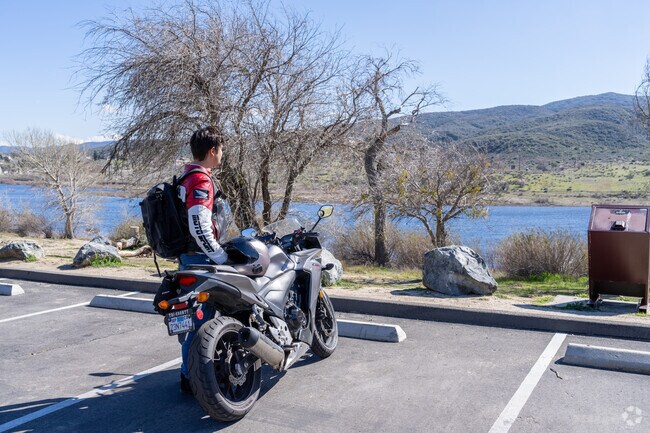 A motorcyclist stops to enjoy the lake view at the Lake Elizabeth picnic area.