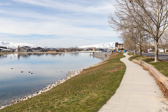 The walking path at Manila Creek Park weaves by the water, providing a peaceful place to exercise.