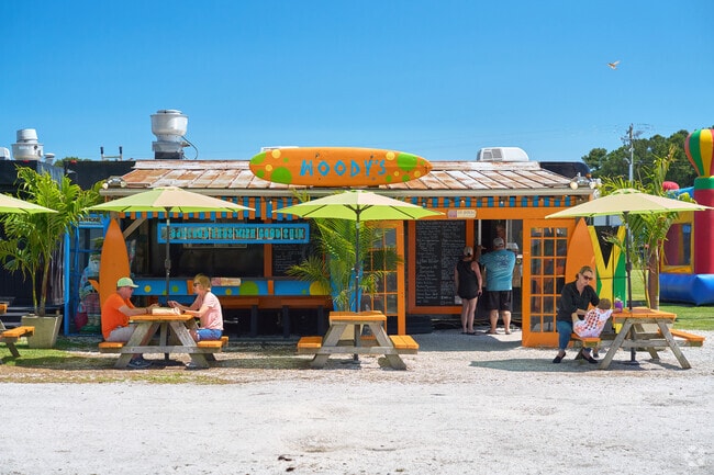 Locals like to grab a quick bite at Woody's Serious Food for BBQ and seafood.