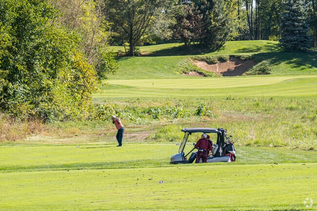 Golfers play a round at the Bowes Creek Golf Course near the Cranston Meadows Park neighborhood.