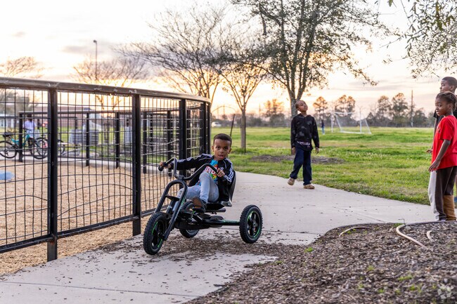 Local Iowa Colony children play at the City Park at Meridiana.