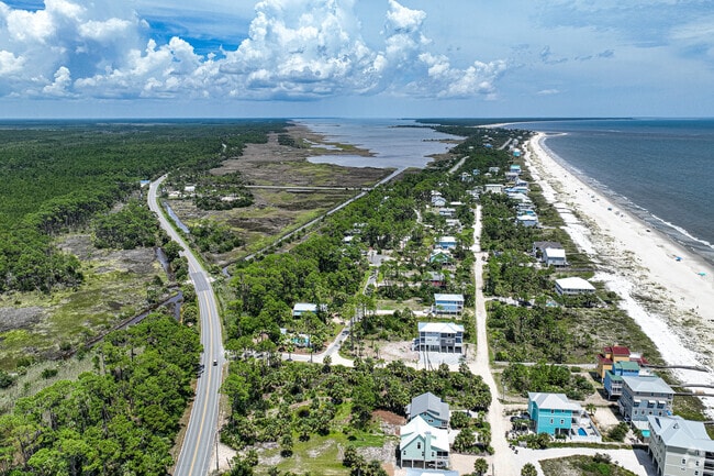Palm trees and open green space contribute to the relaxed, nature-focused atmosphere of Indian Pass.
