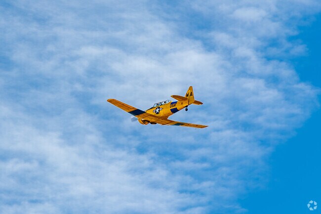 A World War 2 fighter plane flying in the Warbirds Over Monroe Air Show.