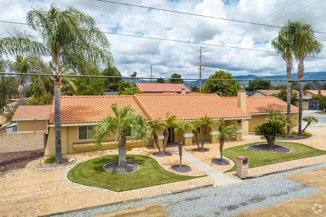 East Hemet features rows of stucco homes with red tile roofs in Spanish revival style.