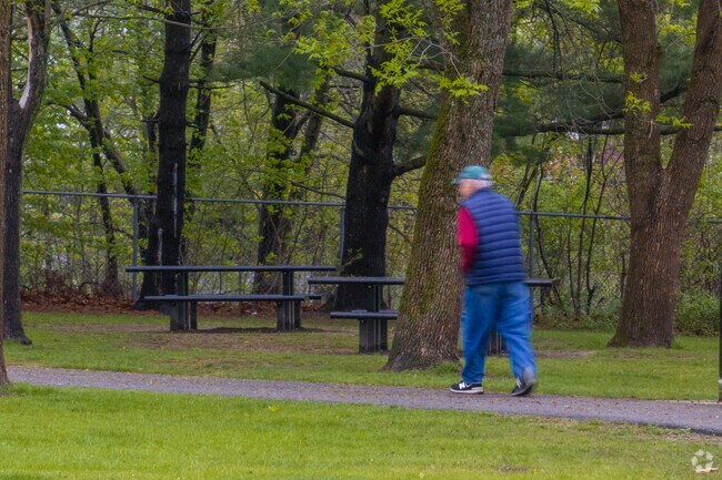 Residents of Tower Hill enjoy the paved pathways throughout the scenic Riverside Park.