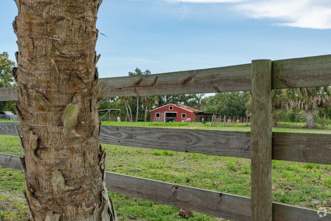Barn and field in Myakka Valley Ranches show rural charm.