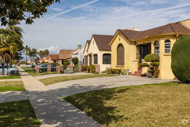 Manchester Square streets are lined with colorful homes in harmonious pastel tones.