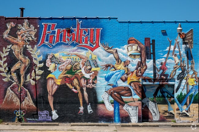 Artful murals adorn Five Points Shopping Center just outside Green Acres.