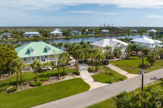 A grouping of large homes on a canal in the West Gulf Drive Neighborhood.