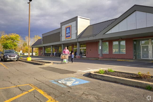 A father and son leaving Aldi's.